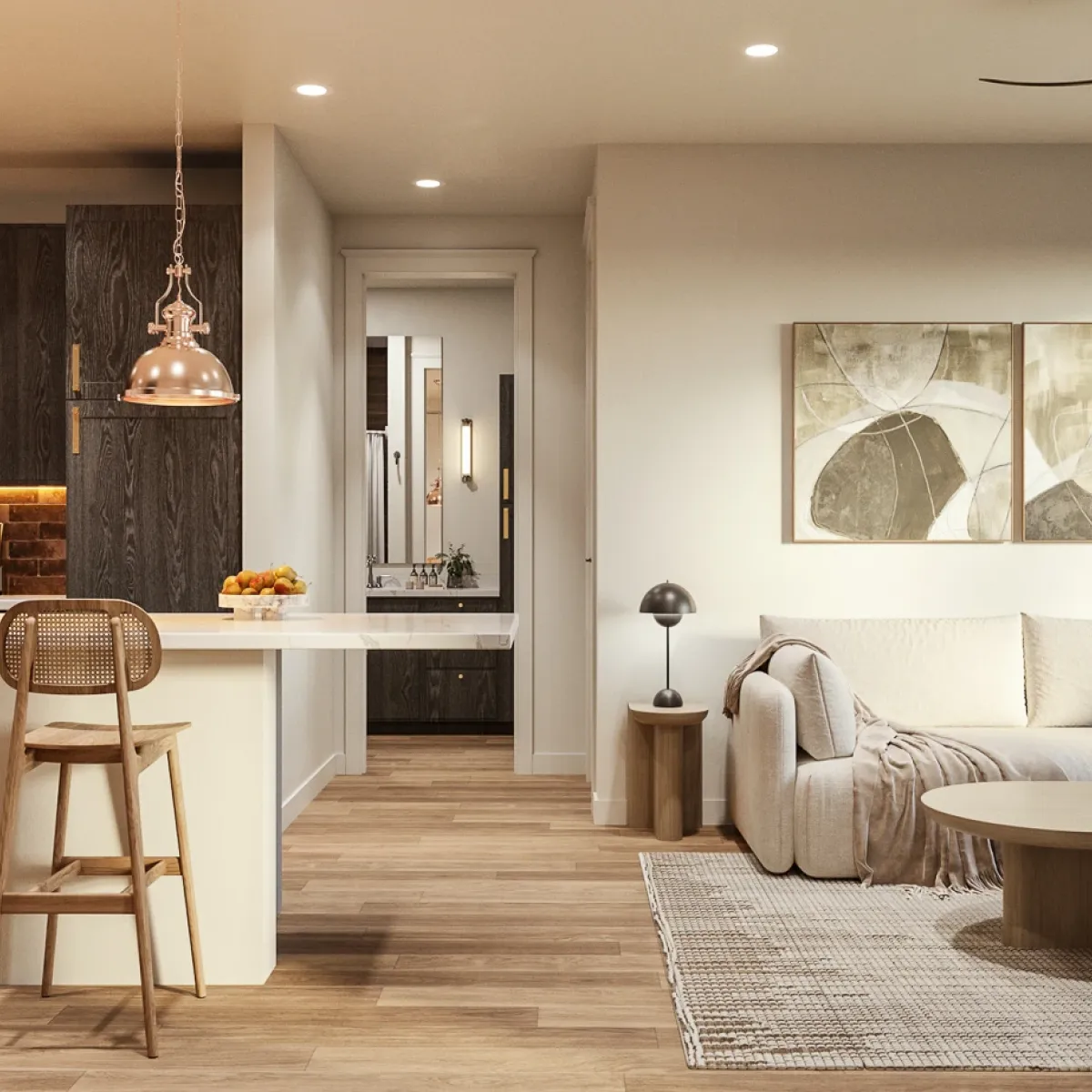 Modern open-concept kitchen and living room with wooden accents, bar stools, and cozy sofa near large windows.
